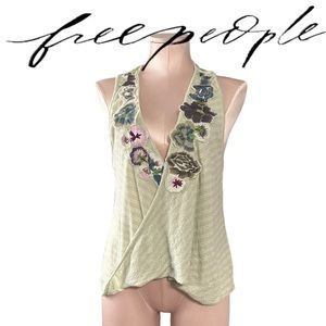 Free People top with flower “patches”. Size XS. Super cute